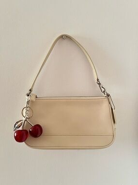 Cream Coach bag